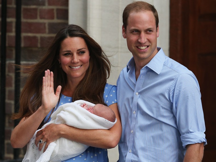 Prince William and Duchess Kate pose with their newborn son before the crowds at St. Mary's Hospital on July 23, 2013 in London, England.