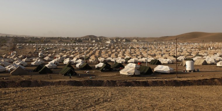 A view of the new refugee camp on the outskirts of the city of Arbil, in Iraq's Kurdistan region, on Aug. 20. The government of Iraqi Kurdistan has set an entry quota of 3,000 refugees a day to cope with an influx of Kurds fleeing the civil war in Syria, but there are signs many more are still coming in, aid agencies said on Tuesday.