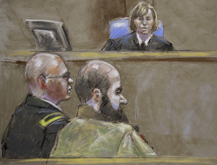 Judge Col. Tara Osborn, top, Maj. Nidal Malik Hasan and standby defense attorney, Lt. Col. Kris Poppe, left, in a courtroom sketch from Wednesday.