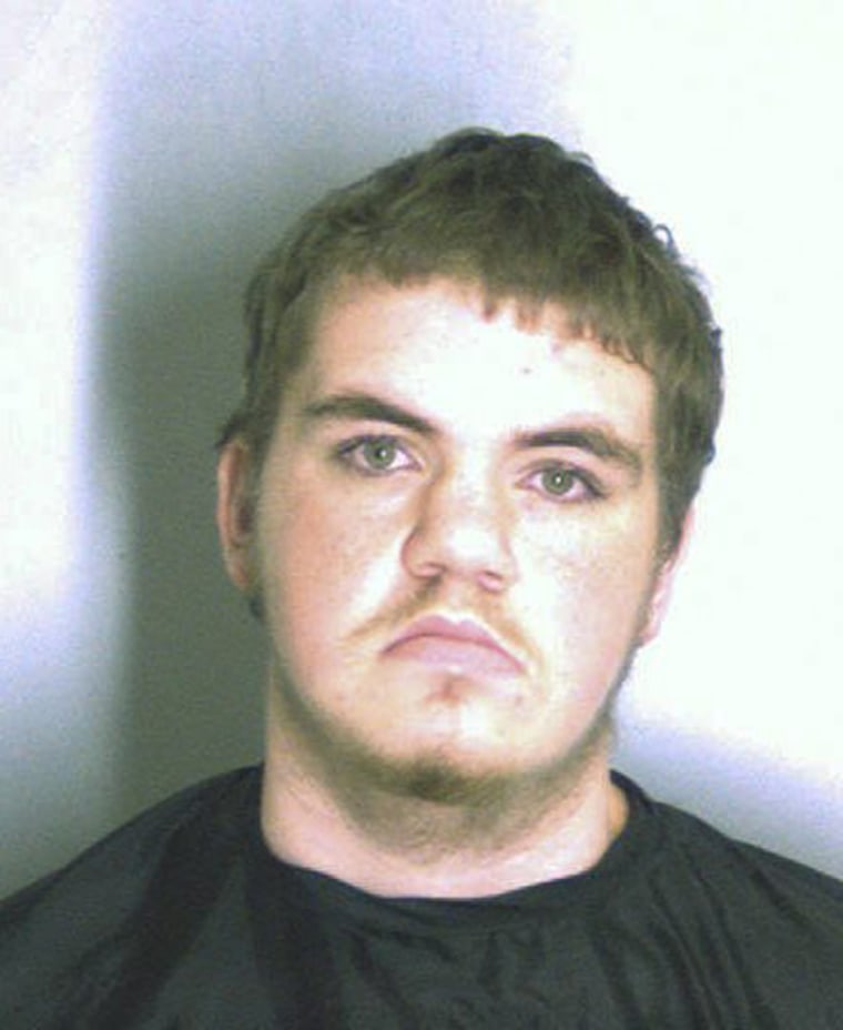 A jail booking photo of school shooting suspect Michael Brandon Hill, 20, on Tuesday.