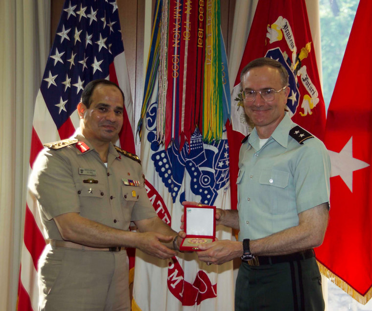 Egyptian army chief General Abdel-Fattah el-Sissi, left, presents a gift to the International Fellows Office to Maj. Gen. David Huntoon, commandant of the U.S. Army War College, in 2006. El-Sissi wrote in research at the college that bringing democracy to the Middle East might lead to conflict.