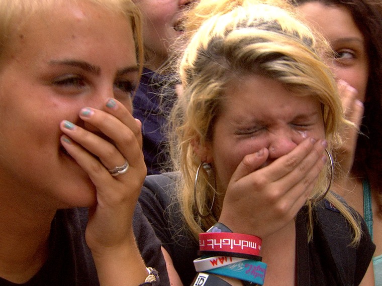 A fan cries while watching One Direction perform on TODAY.