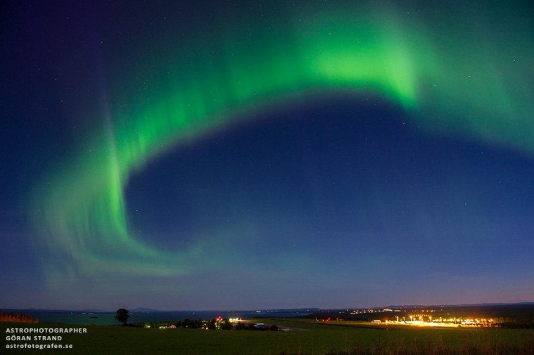 Goran Strand's photo from northern Sweden, taken on the night of Aug. 22-23, shows an arc of auroral lights towering over the Are/Ostersund airport.