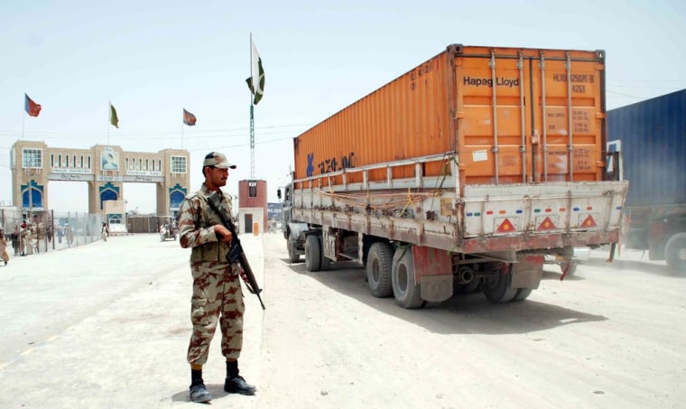 A truck carrying supplies for NATO forces in Afghanistan waits for clearance near the border at Chaman, Pakistan, on July 5, 2012. Pakistan's cabinet had approved the re-opening of supply routes a day earlier, ending a seven-month dispute.
