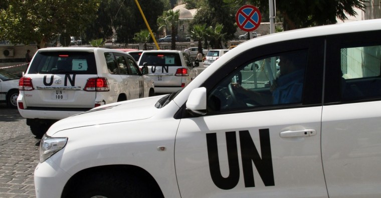 A convoy of UN inspectors leaves a hotel in Damascus, Syria.