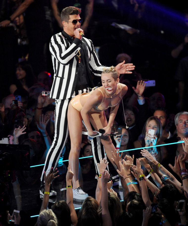 Robin Thicke, left, and Miley Cyrus perform at the MTV Video Music Awards on Sunday, Aug. 25, 2013, at the Barclays Center in the Brooklyn borough of ...