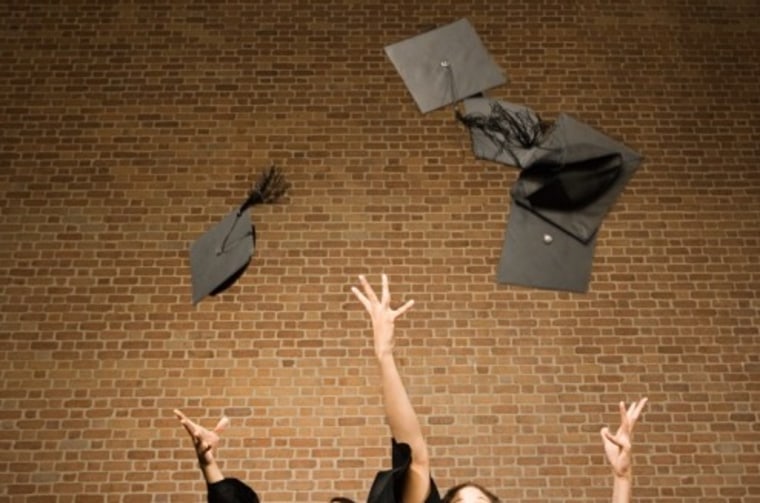 Graduates throwing their mortar boards