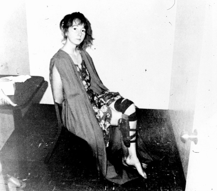 Lynette Fromme sits in an interrogation room shortly after her capture, with an empty holster still strapped to her leg.
