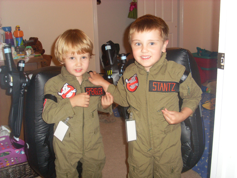 Elliott Dash, left, and his older brother Oliver Dash pose in their favorite outfits: \"Ghostbusters\" suits.