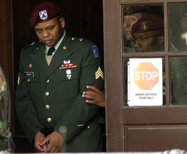 Sgt. Hasan Akbar, left, is led from the Staff Judge Advocate Building at Fort Bragg, N.C., in April 2005, during the sentencing phase of his court-martial.