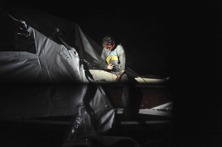 Boston Marathon bombing suspect Dzhokhar Tsarnaev leans over in a boat at the time of his capture by law enforcement authorities in Watertown, Mass, on April 19, 2013.