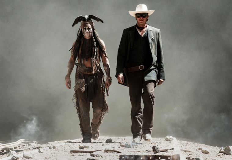 This undated publicity photo released by Disney and Jerry Bruckheimer, Inc. shows Johnny Depp, left, as Tonto, and Armie Hammer, as The Lone Ranger, i...
