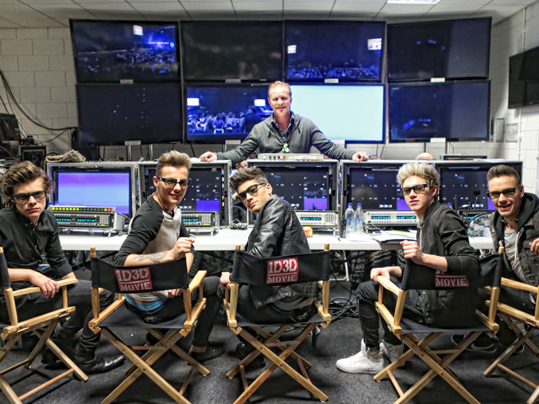 Harry Styles, Louis Tomlinson, Zayn Malik, Niall Horan and Liam Payne with director Morgan Spurlock on location for