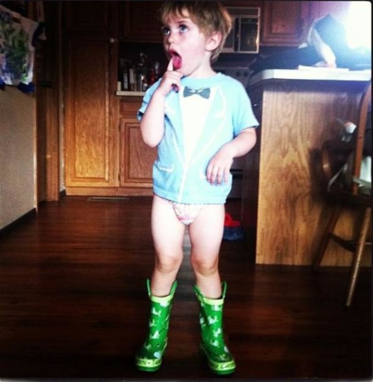 Three-year-old Joshua Latham of Red River, N.M., strikes a pose in a tuxedo T-shirt and wellies.