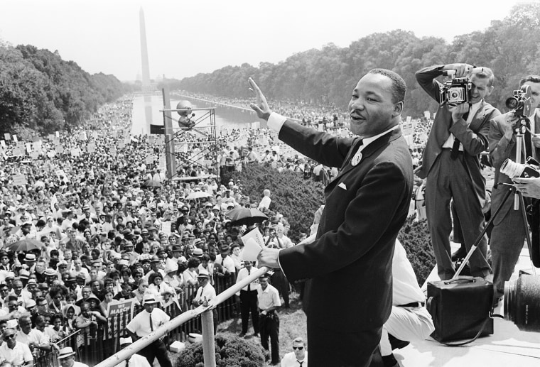 Martin Luther King, Jr. waves to supporters on the Mall in Washington DC, on Aug. 28, 1963.