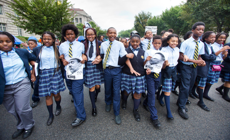 Students with the Dupont Park Adventist School take part in a 50th anniversary commemoration of Martin Luther King's famous