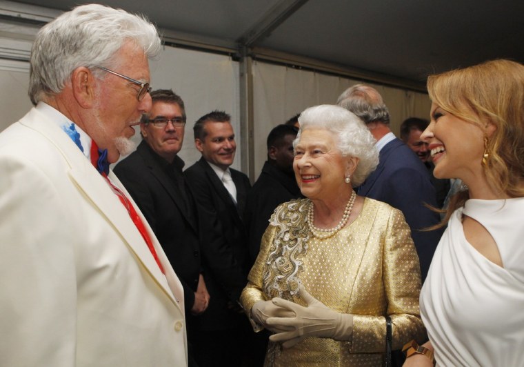 Rolf Harris talks with Queen Elizabeth II and Kylie Minogue, right, after the Diamond Jubilee Buckingham Palace Concert in June 2012 in London.