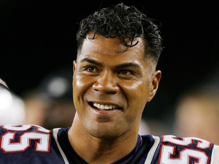 FOXBORO, MA - AUGUST 19: Junior Seau #55 of the New England Patriots smiles from the sidelines as his team plays the Arizona Cardinals during their p...