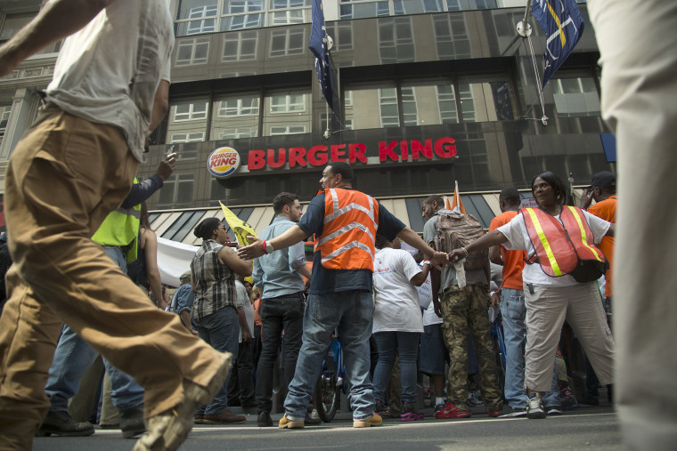 People protest outside Burger King in New York's financial district.