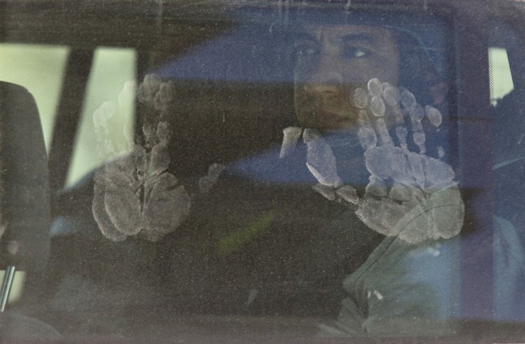 Hand prints are seen on a United Nations vehicle carrying a team of U.N. chemical weapons experts visiting one of the sites of an alleged chemical weapons attack in the Ain Tarma neighborhood of Damascus, Aug. 28.