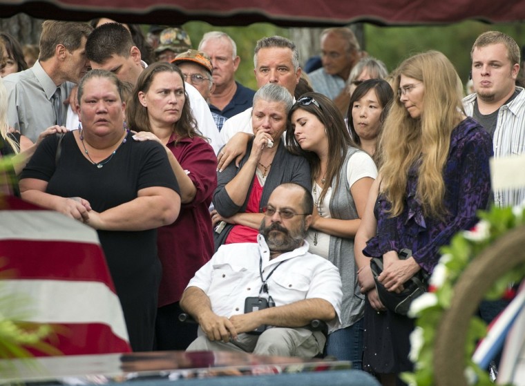 With hundreds in attendance, Spokane veteran Delbert Belton is buried with full military honors during a public service at Greenwood Memorial Terrace in Spokane, Wash. on Aug. 29. Belton, 88, died Aug. 21, 2013, after being beaten to death durig a robbery in the Eagle's Lodge parking lot in Spokane, Wash.