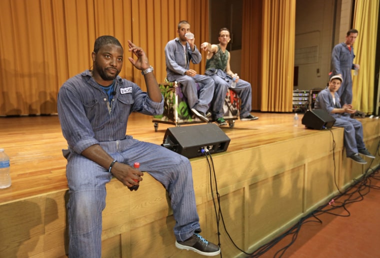 Rappers Postell Pringle, JQ and GQ, DJ Clayton Stamper, and rapper Jackson Doran take questions from the audience at the Cook County Jail.