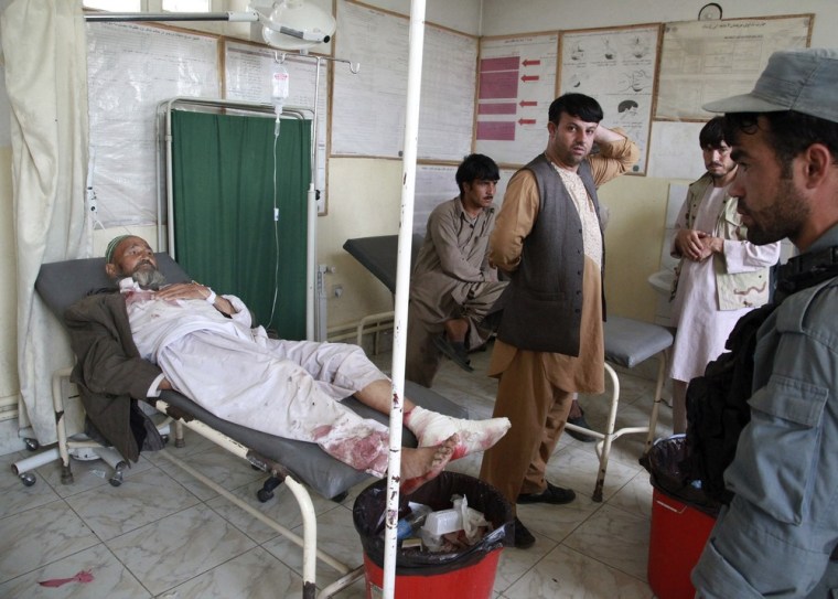 An injured man lies in a hospital in Takhar on Friday after a suicide attack in neighboring Kunduz province.