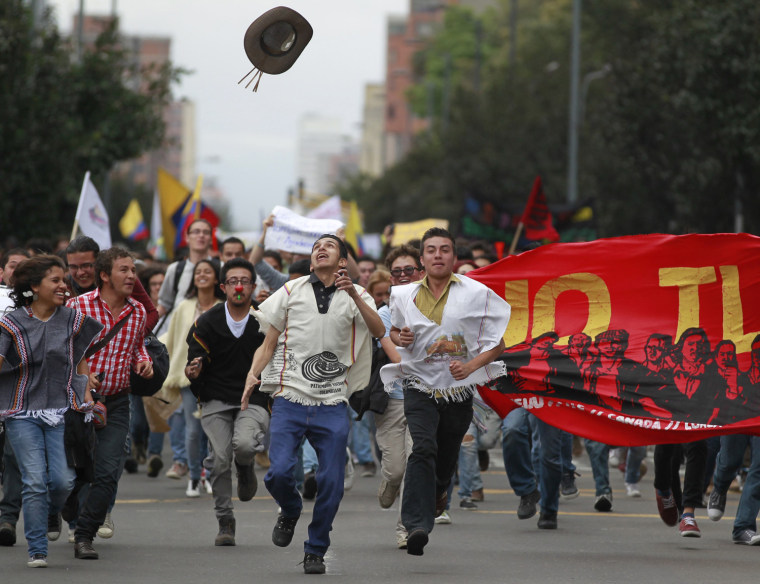 Student demonstrators take part in a protest against agricultural and trade policies in Bogota, Colombia, on Aug. 29, 2013.