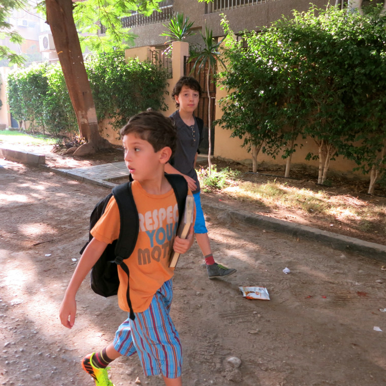 X and T, walking to school in Cairo on their first week.