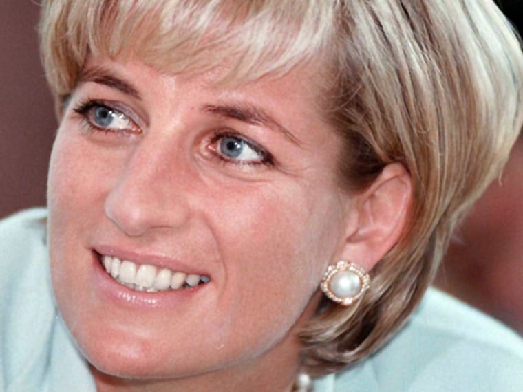 **  FILE  ** Diana, the Princess of Wales smiles during her visit to Leicester England  in this May 27, 1997 file photo. The mounds of flowers are lon...