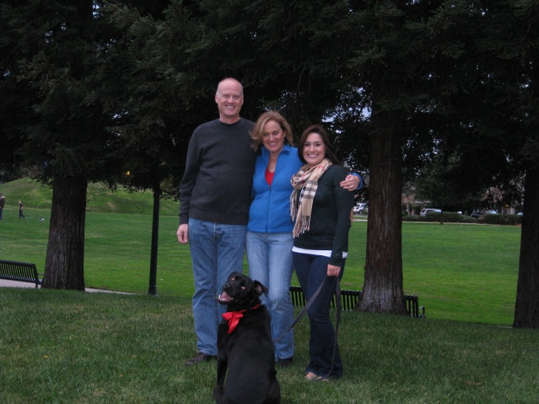 Image: Dave Baker and Susan Harvell with their daughter, Claire, and their dog, Maverick