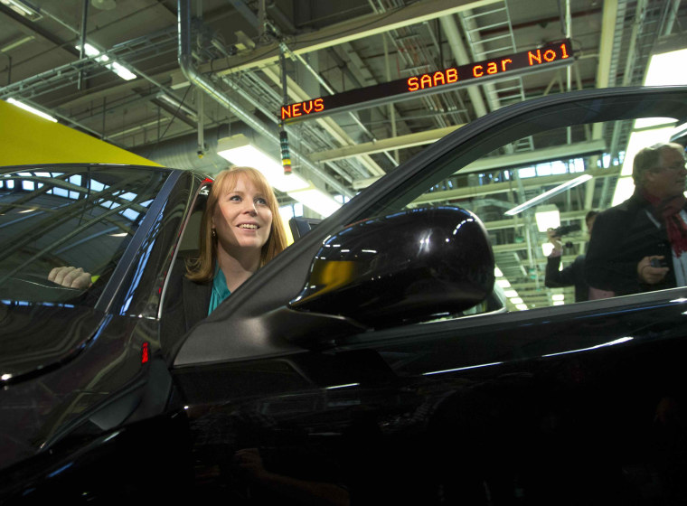 Swedish Minister for Enterprise Annie Loof looks out of a first production NEVS Saab 9-3 Aero at the Trollhattan factory in Sweden on Dec. 2.
