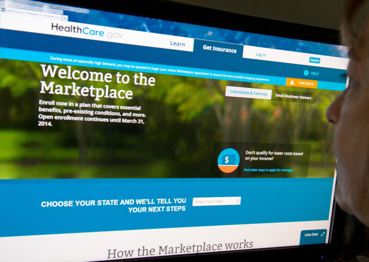 A woman reads the HealthCare.gov insurance marketplace internet site in Washington, D.C., on Dec. 2.