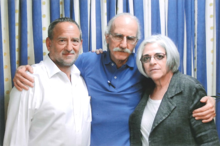 Alan Gross, center, with lawyer Scott Gilbert and wife Judy in the prison where he is being held in Cuba.