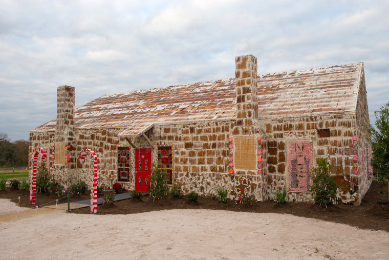The community of Bryan, Texas, has come together to build the world's biggest gingerbread house, with proceeds from visitors going to support fund-raising for a local hospital.