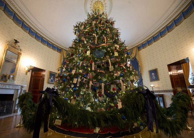 The ornament laden White House Christmas tree is seen in the Blue Room of the White House in Washington, Wednesday, Dec. 4, 2013. (AP Photo/Jacquelyn ...