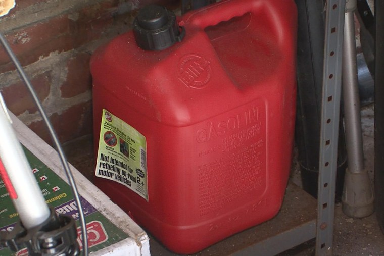 A gas can sits in a garage.