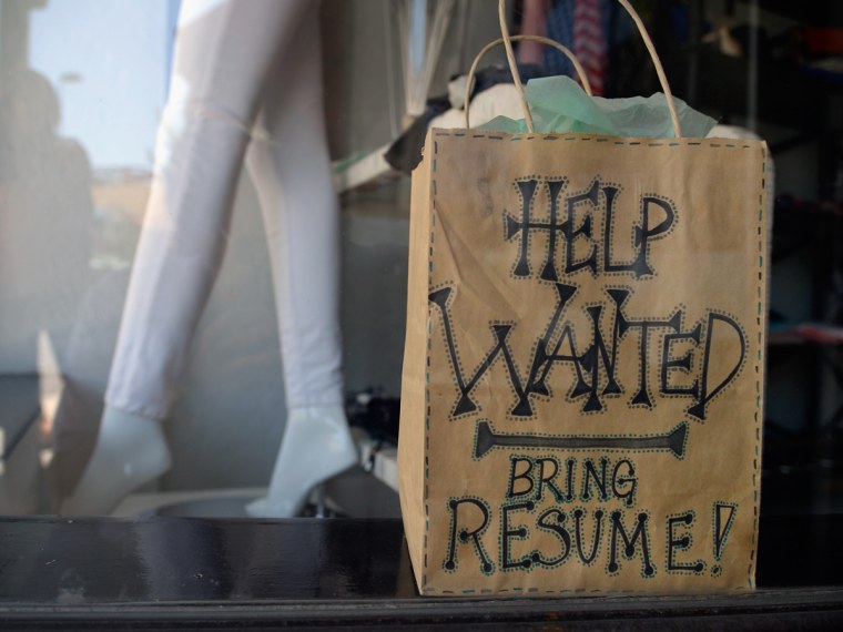 PASADENA, CA - JUNE 21: A help wanted sign is placed in the window of Veronica M clothing store on June 21, 2013 in Pasadena, California. California ...
