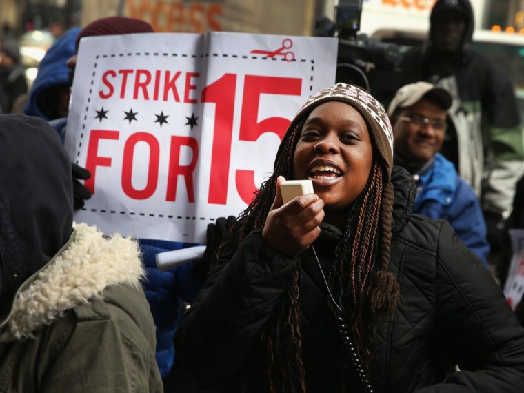 Charde Nabors, a Sears employee, protests with fast-food and retail workers demanding higher pay outside a Sears store in the Loop on Dec. 5 in Chicago,