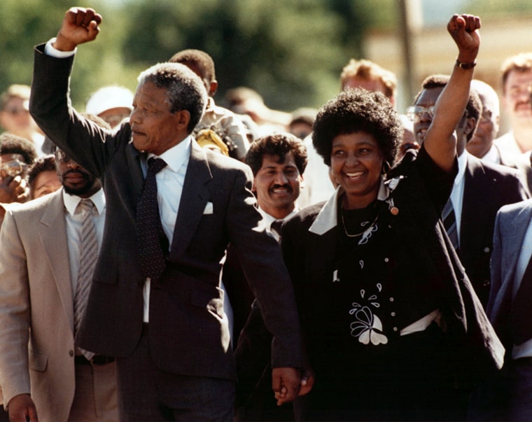 Nelson Mandela and wife Winnie, walking hand in hand, raise clenched fists upon his release from Victor prison, Cape Town, Sunday, February 11, 1990.  The African National Congress leader had served over 27 years in detention.