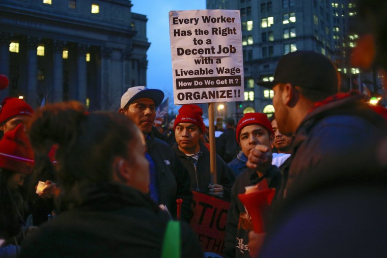 Demonstrators gather during a nationwide strike and protest at fast food restaurants to raise the minimum hourly wage to $15 in New York, December 5, ...