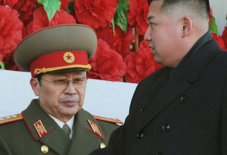 North Korean leader Kim Jong Un, right, walks past his uncle Jang Song-thaek during a military parade on Feb. 16, 2012.
