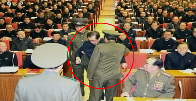 North Korean leader Kim Jong Un's uncle Jang Song Thaek, center, is arrested during an enlarged meeting of the Political Bureau of the Central Committee of the Workers' Party in Pyongyang on Sunday.