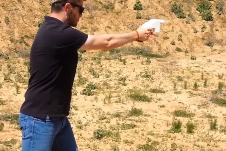 Cody Wilson, founder of Defense Distributed, fires a 3D-printed handgun known as the Liberator.