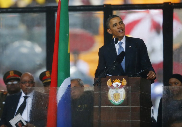 President Barack Obama eulogizes the late South African President Nelson Mandela at the FNB soccer stadium in Johannesburg.