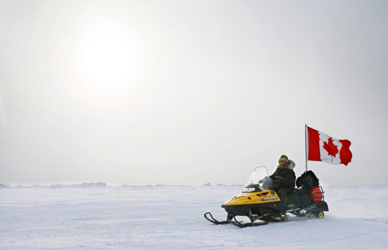 Ranger Joe Amarualik, from Iqaluit, Nunavut, drives his snowmobile on the ice during a Canadian Ranger sovereignty patrol near Eureka, Ellesmere Island, in 2007.