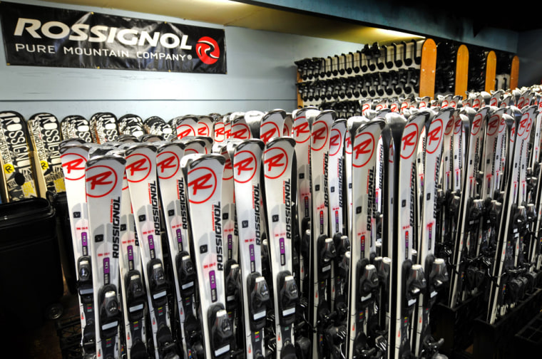 This January 2013 photo shows a display of skis for rent at the Ski & Ride Center at Schweitzer Mountain Resort in Sandpoint, Idaho. Some skiers see renting gear as a good alternative to bringing their own skis on a plane.