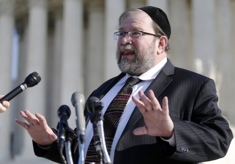 Rabbi S. Binyomin Ginsberg talks to reporters about his case, in which he sued Northwest Airlines for breach of contract after the airline said he had abused their frequent flier program, after it was argued before the Supreme Court on Dec. 3.