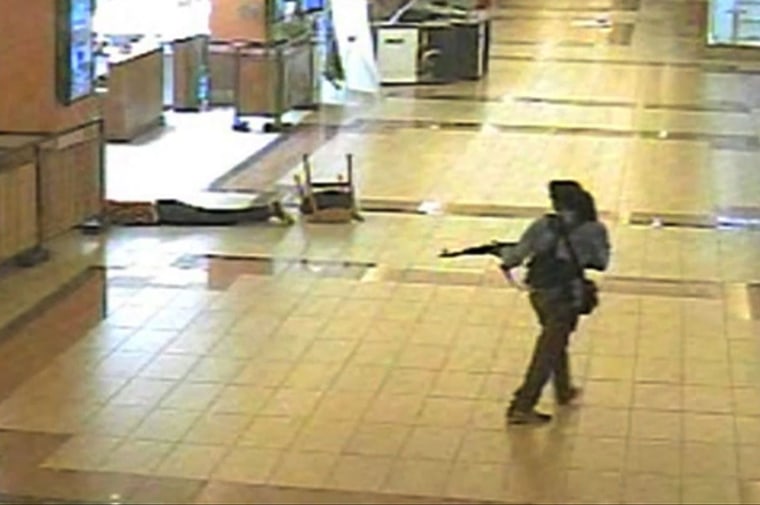 An armed man walks through the Westgate Mall in Nairobi on Sept. 21 in this image from closed circuit television.