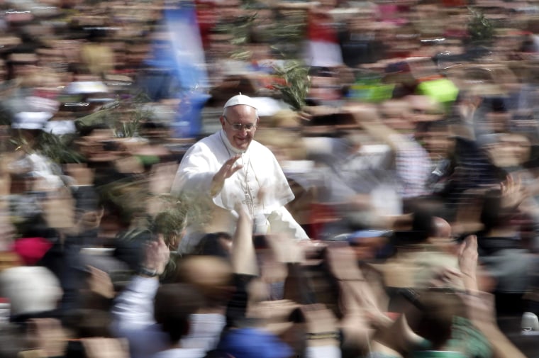 Pope Francis waves as he leaves after the Palm Sunday mass at Saint Peter's Square at the Vatican March 24, 2013. REUTERS/Max Rossi (VATICAN - Tags: R...
